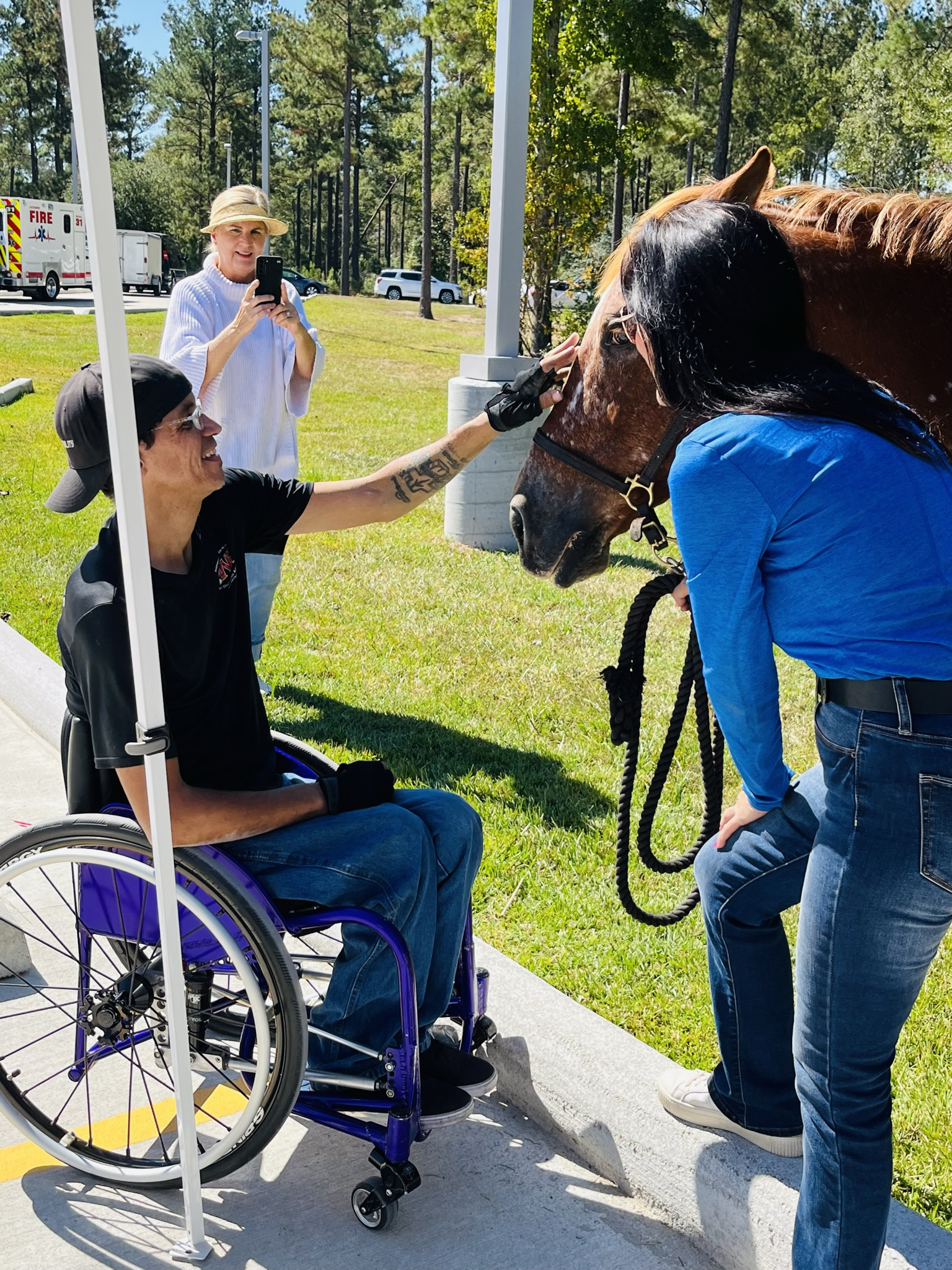 Man in wheelchair with horse